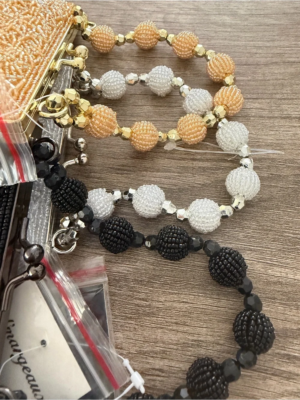 Beaded Heart Wristlet Clutch in Black, silver & Gold